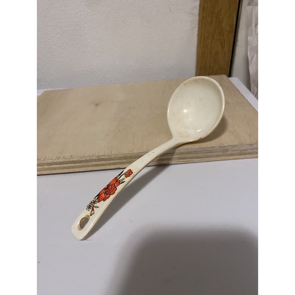 vintage Ekco melamine soup ladle featuring a floral pattern